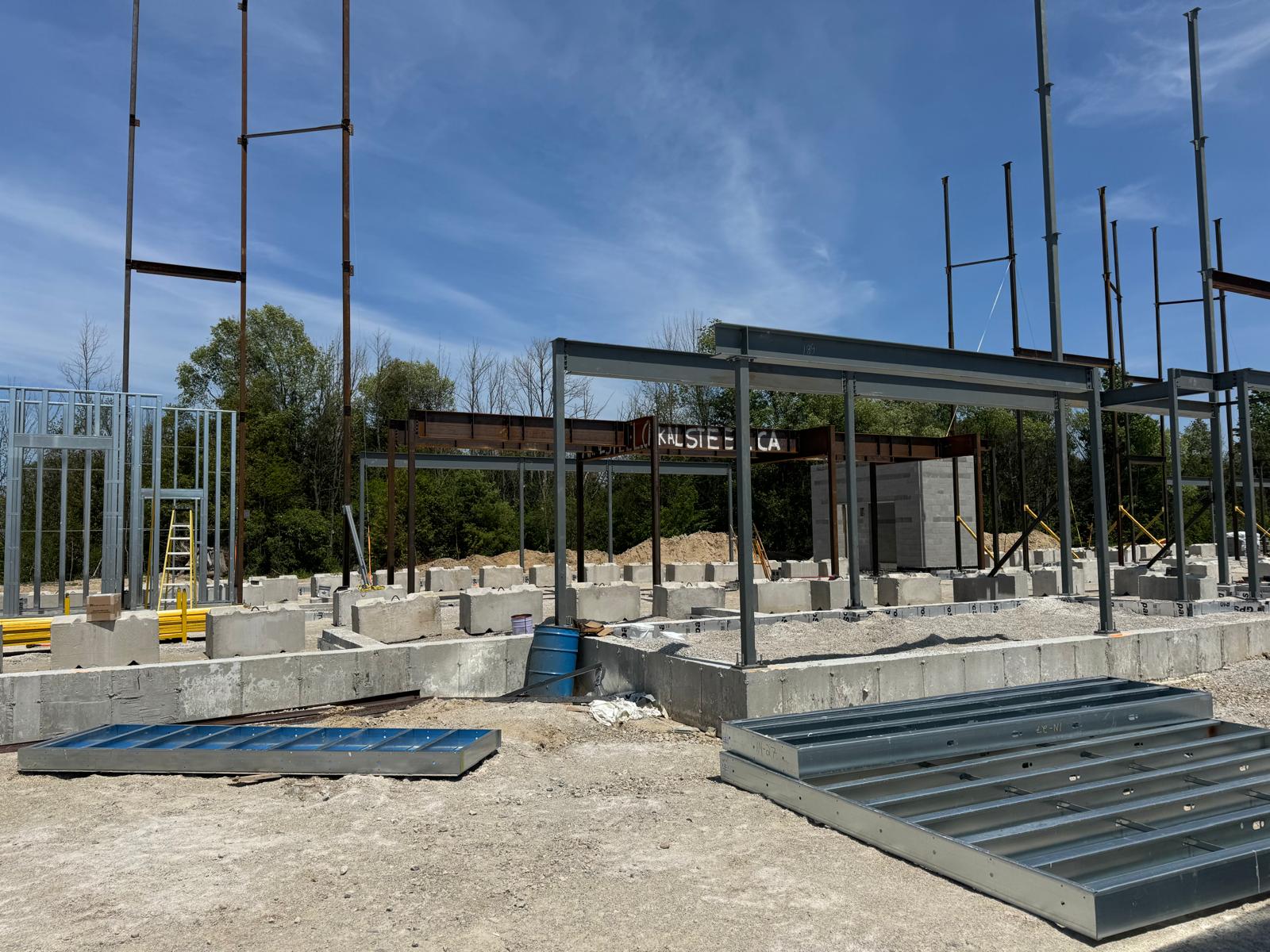 Commercial building structure with steel columns, beams and light-gauge wall framing