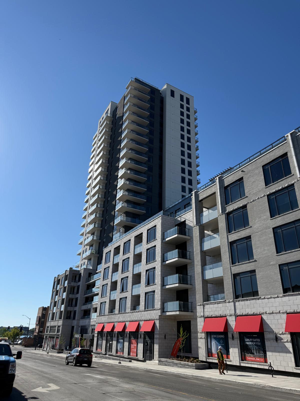 Completed mixed-use tower with retail at street level