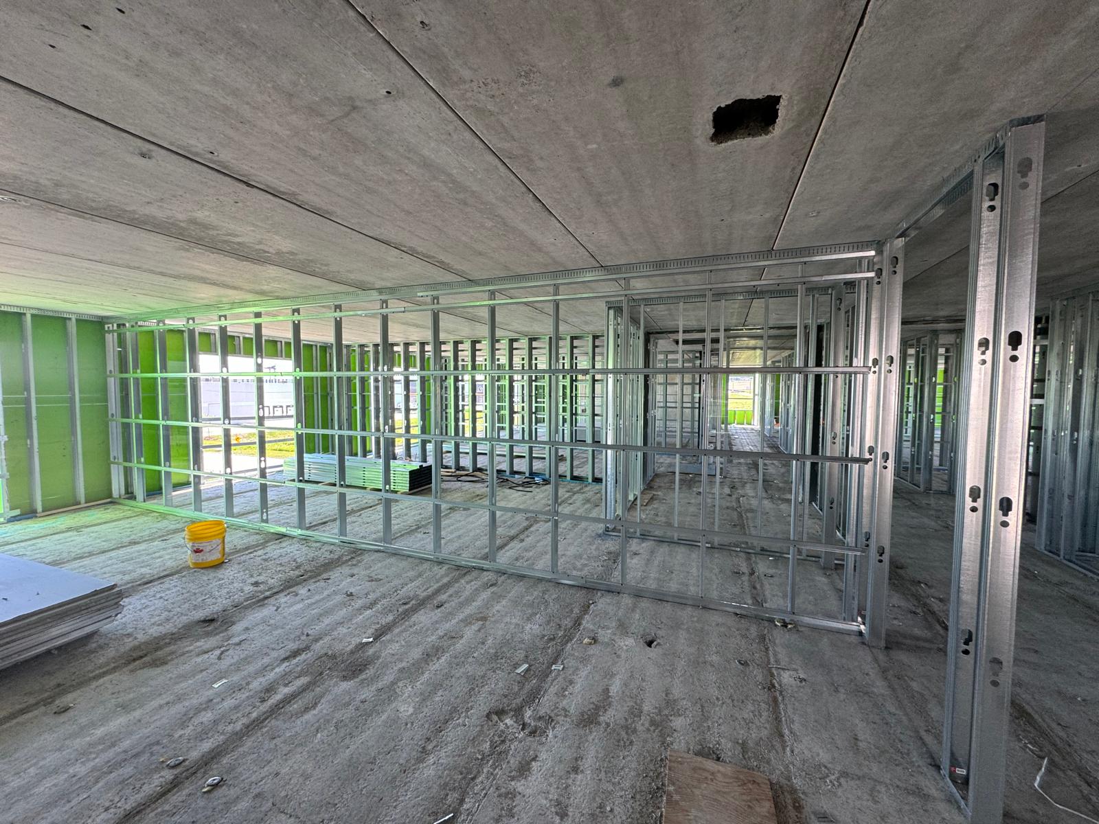 Commercial interior under construction with light-gauge steel partition framing